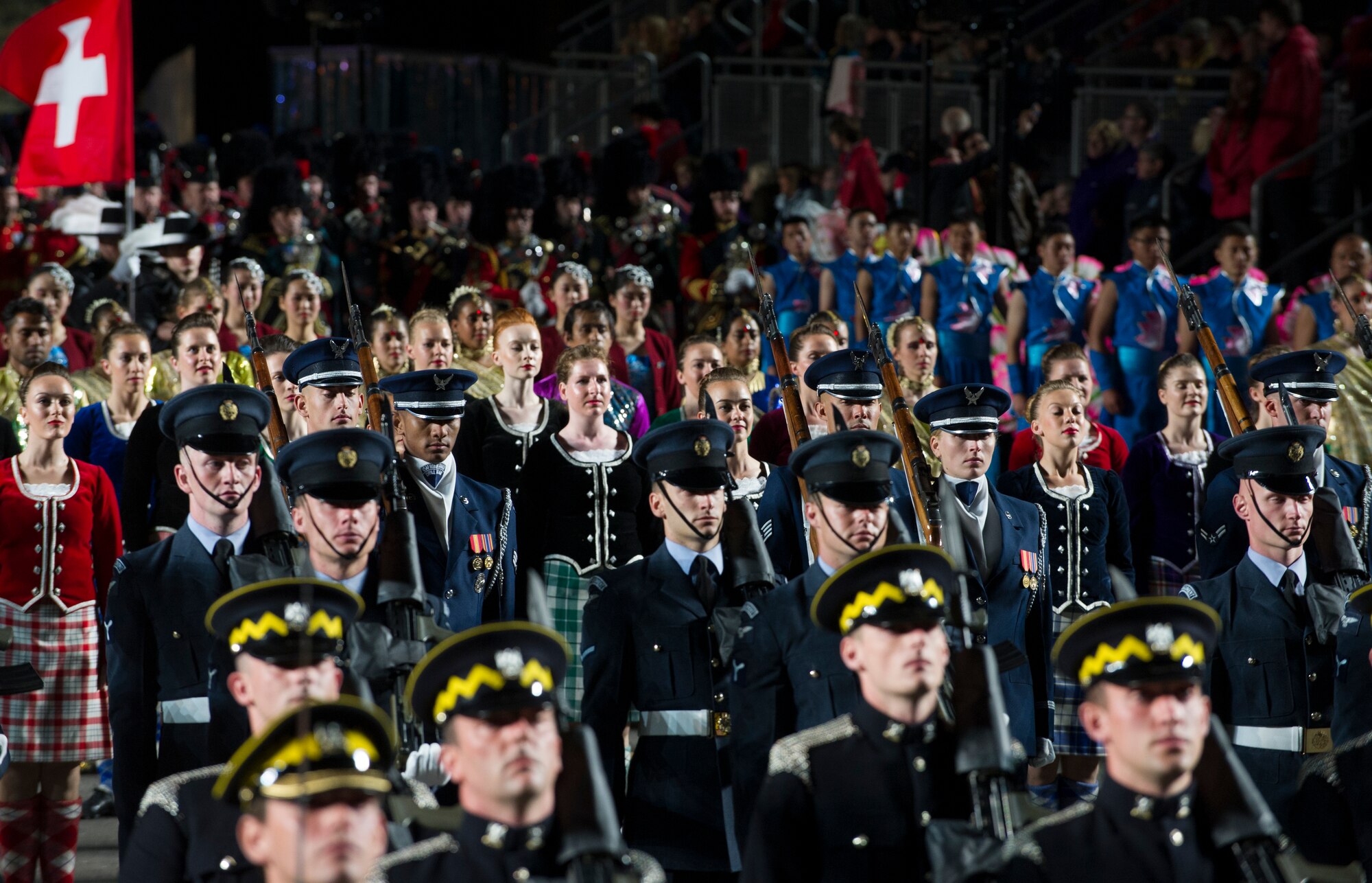 The United States Air Force Honor Guard Drill Team stands in formation after performing for thousands of people during The Royal Edinburgh Military Tattoo on the Esplanade of the Edinburgh Castle in Edinburgh, Scotland Aug. 6, 2015. The 66th production of the tattoo welcomes more than 220,000 spectators from around the world for more than 3 weeks. The event includes 17 acts for 25 performances and welcomes more than 1,390 performers from the US, Europe, Asia, Australia and Canada. The show features Bollywood dancers from India, the Military Band of the People’s Liberation Army of China, the Top Secret Drum Corps from Switzerland, the Royal Air Force and Queen’s Colour Squadron Mass Band and more. (U.S. Air Force photo/Staff Sgt. Nichelle Anderson/Released)