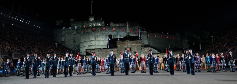 The United States Air Force Honor Guard Drill Team stands in formation after performing for thousands of people during The Royal Edinburgh Military Tattoo on the Esplanade of the Edinburgh Castle in Edinburgh, Scotland Aug. 6, 2015. The 66th production of the tattoo welcomes more than 220,000 spectators from around the world for more than 3 weeks. The event includes 17 acts for 25 performances and welcomes more than 1,390 performers from the US, Europe, Asia, Australia and Canada. The show features Bollywood dancers from India, the Military Band of the People’s Liberation Army of China, the Top Secret Drum Corps from Switzerland, the Royal Air Force and Queen’s Colour Squadron Mass Band and more. (U.S. Air Force photo/Staff Sgt. Nichelle Anderson/Released)