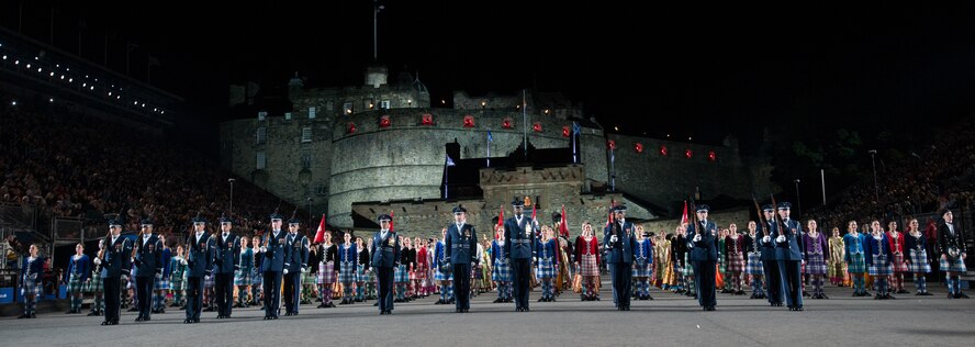 The United States Air Force Honor Guard Drill Team stands in formation after performing for thousands of people during The Royal Edinburgh Military Tattoo on the Esplanade of the Edinburgh Castle in Edinburgh, Scotland Aug. 6, 2015. The 66th production of the tattoo welcomes more than 220,000 spectators from around the world for more than 3 weeks. The event includes 17 acts for 25 performances and welcomes more than 1,390 performers from the US, Europe, Asia, Australia and Canada. The show features Bollywood dancers from India, the Military Band of the People’s Liberation Army of China, the Top Secret Drum Corps from Switzerland, the Royal Air Force and Queen’s Colour Squadron Mass Band and more. (U.S. Air Force photo/Staff Sgt. Nichelle Anderson/Released)