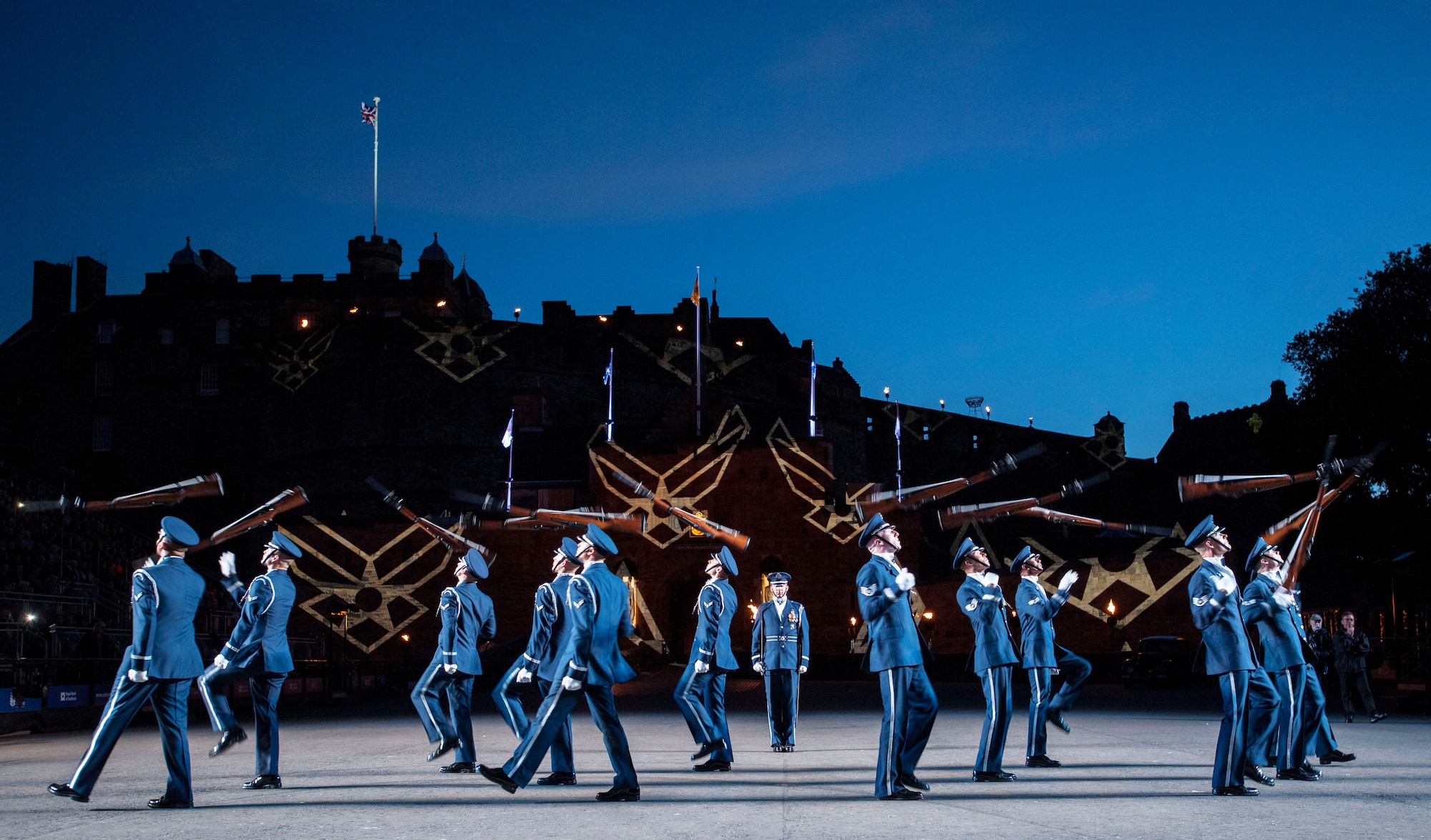 The United States Air Force Honor Guard Drill Team poses for a group photo after performing at the Royal Edinburgh Military Tattoo on the Esplanade of the Edinburgh Castle in Edinburgh, Scotland Aug. 6, 2015. A 20-member group of the Honor Guard Drill Team traveled to the United Kingdom to represent the USAF and the Department of Defense as the only branch of military service from the U.S. performing in the tattoo. (U.S. Air Force photo/Staff Sgt. Nichelle Anderson/Released)