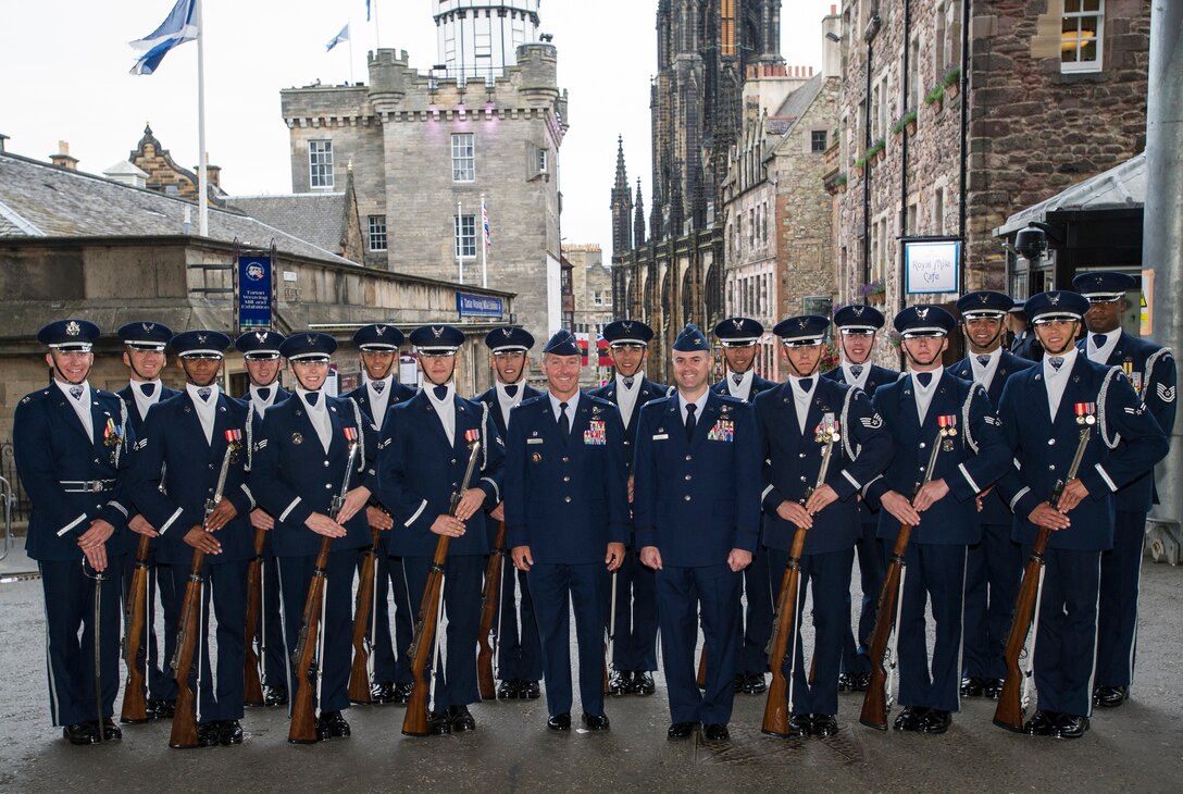 Col. Brad Hoagland, 11th Wing/Joint Base Andrews commander and Col. Jon Julian, 11th Operations Group commander pose for a group photo with the United States Air Force Honor Guard Drill Team after performing at the Royal Edinburgh Military Tattoo on the Esplanade of the Edinburgh Castle in Edinburgh, Scotland Aug. 8, 2015. A 20-member group of the Honor Guard Drill Team traveled to the United Kingdom to represent the USAF and the Department of Defense as the only branch of military service from the U.S. performing in the tattoo. (U.S. Air Force photo/Staff Sgt. Nichelle Anderson/Released)