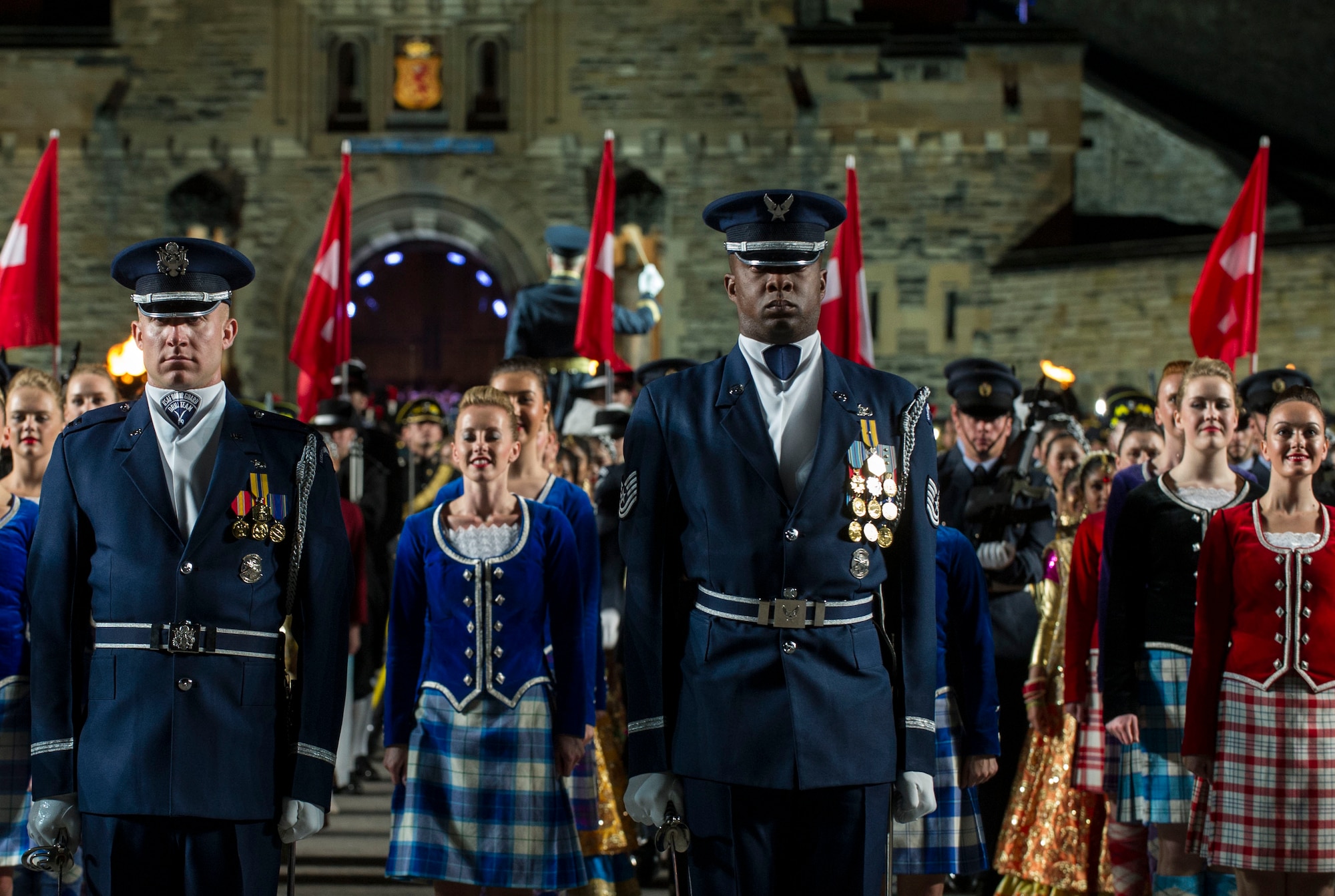 Capt. Cahn Wadhams, United States Air Force Honor Guard Drill Team commander and Tech. Sgt. Maurice Cheaney, USAF Honor Guard Drill Team NCO-in-charge of training stand in formation during the finale of the preview show of Royal Edinburgh Military Tattoo on the Esplanade of the Edinburgh Castle in Edinburgh, Scotland Aug. 6, 2015. (U.S. Air Force photo/Staff Sgt. Nichelle Anderson/Released)