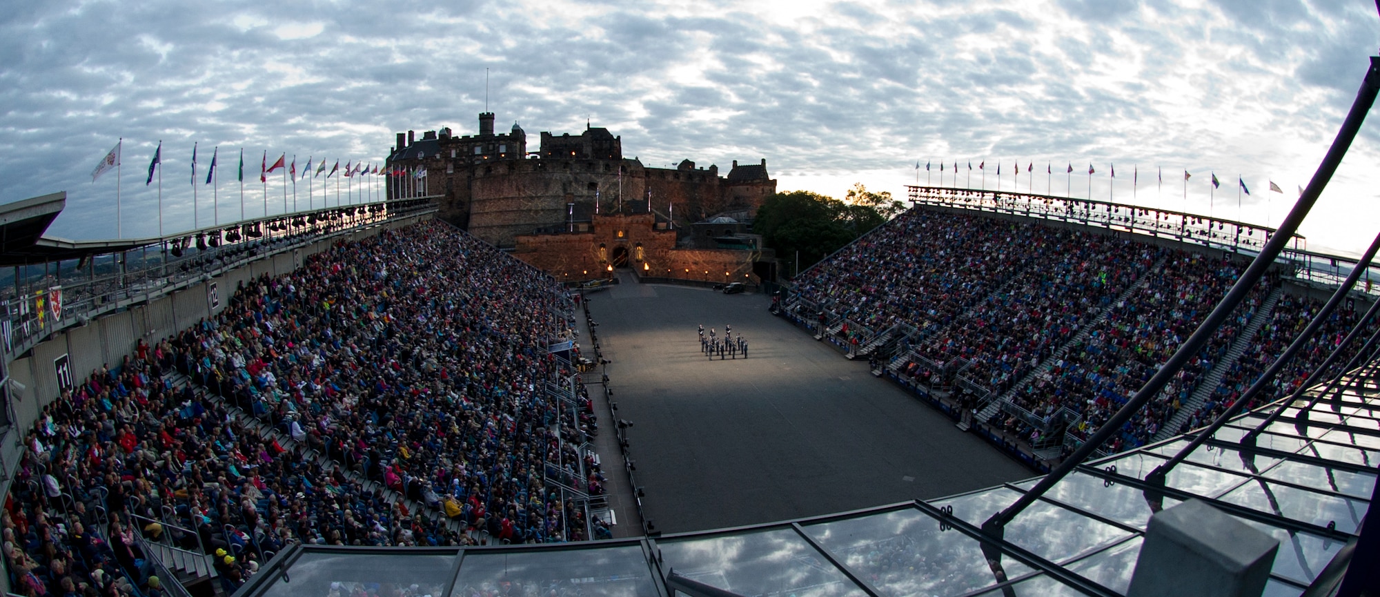The United States Air Force Honor Guard Drill Team performs for thousands of people during The Royal Edinburgh Military Tattoo on the Esplanade of the Edinburgh Castle in Edinburgh, Scotland Aug. 7, 2015. The 66th production of the tattoo welcomes more than 220,000 spectators from around the world for more than 3 weeks. The event includes 17 acts for 25 performances and welcomes more than 1,390 performers from the US, Europe, Asia, Australia and Canada. The show features Bollywood dancers from India, the Military Band of the People’s Liberation Army of China, the Top Secret Drum Corps from Switzerland, the Royal Air Force and Queen’s Colour Squadron Mass Band and more. (U.S. Air Force photo/Staff Sgt. Nichelle Anderson/Released)