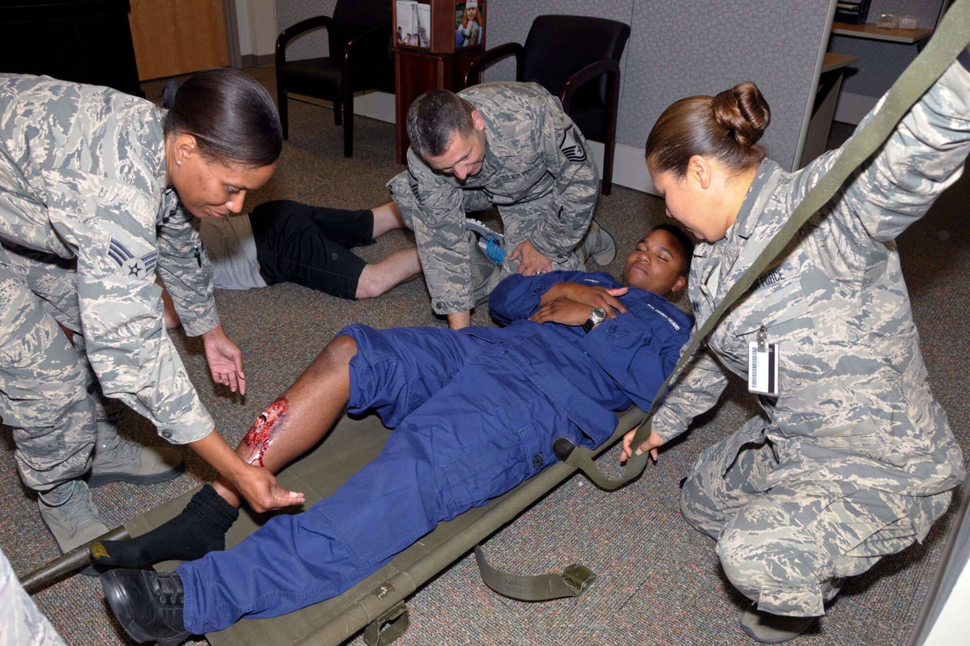 Medical, security and other personnel from the Michigan Air National Guard’s 127th Wing, Coast Guard Air Station Detroit and other organizations participate in a mass casualty and active shooter exercise Friday, Aug. 7, 2015, at Selfridge Air National Guard Base, Mich. (U.S. Air National Guard photo by Brittani Baisden/Released)