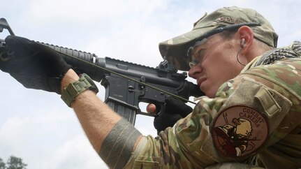 Air Force Staff Sgt. Sam Weaver, a Combat Camera Airman, assigned to the 1st Combat Camera Squadron, shoots his M4 carbine rifle during the 3rd Annual Spc. Hilda I. Clayton Best Combat Camera (COMCAM) Competition qualification range at Fort George G. Meade, Md., July 14, 2015. Weapons qualification is conducted on day two of the Spc. Hilda I. Clayton Best COMCAM Competition, where teams of two compete throughout a weeklong event that assesses the technical and tactical skills of visual information personnel. The Competition is established in honoring fallen combat camera Soldier Spc. Hilda I. Clayton, who gave her life July 2, 2013, in Afghanistan as a part of Operation Enduring Freedom. (U.S. Army photo / Staff Sgt. Kwadwo Frimpong) 



3 of 3
DOWNLOAD HI-RES  /   PHOTO DETAILS 


U.S. Air Force Staff Sgt. Sam Weaver, a Combat Camera Airman, assigned to the 1st Combat Camera Squadron, shoots his M4 carbine rifle during the 3rd Annual Spc. Hilda I. Clayton Best Combat Camera (COMCAM) Competition qualification range at Fort George G. Meade, Md., July 14, 2015. Weapons qualification is conducted on day two of the Spc. Hilda I. Clayton Best COMCAM Competition, where teams of two compete throughout a weeklong event that assesses the technical and tactical skills of visual information personnel. The Competition is established in honoring fallen combat camera Soldier Spc. Hilda I. Clayton, who gave her life July 2, 2013, in Afghanistan as a part of Operation Enduring Freedom. (U.S. Army photo by Staff Sgt. Kwadwo Frimpong/Released)
    

 

Share on facebook
 

More Sharing Services
 

Share on twitter
 

  

PRINT | E-MAIL