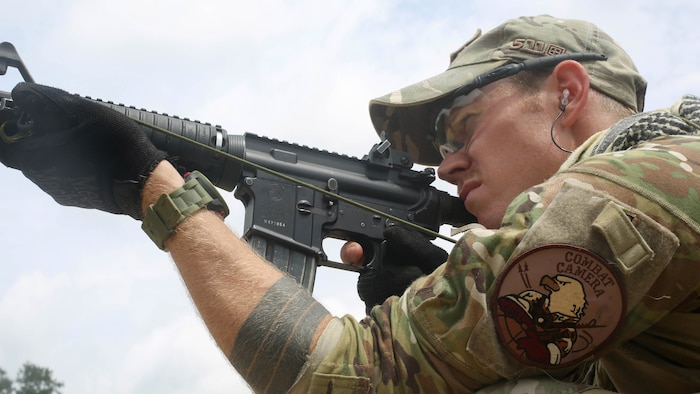 Air Force Staff Sgt. Sam Weaver, a Combat Camera Airman, assigned to the 1st Combat Camera Squadron, shoots his M4 carbine rifle during the 3rd Annual Spc. Hilda I. Clayton Best Combat Camera (COMCAM) Competition qualification range at Fort George G. Meade, Md., July 14, 2015. Weapons qualification is conducted on day two of the Spc. Hilda I. Clayton Best COMCAM Competition, where teams of two compete throughout a weeklong event that assesses the technical and tactical skills of visual information personnel. The Competition is established in honoring fallen combat camera Soldier Spc. Hilda I. Clayton, who gave her life July 2, 2013, in Afghanistan as a part of Operation Enduring Freedom. (U.S. Army photo / Staff Sgt. Kwadwo Frimpong) 



3 of 3
DOWNLOAD HI-RES  /   PHOTO DETAILS 


U.S. Air Force Staff Sgt. Sam Weaver, a Combat Camera Airman, assigned to the 1st Combat Camera Squadron, shoots his M4 carbine rifle during the 3rd Annual Spc. Hilda I. Clayton Best Combat Camera (COMCAM) Competition qualification range at Fort George G. Meade, Md., July 14, 2015. Weapons qualification is conducted on day two of the Spc. Hilda I. Clayton Best COMCAM Competition, where teams of two compete throughout a weeklong event that assesses the technical and tactical skills of visual information personnel. The Competition is established in honoring fallen combat camera Soldier Spc. Hilda I. Clayton, who gave her life July 2, 2013, in Afghanistan as a part of Operation Enduring Freedom. (U.S. Army photo by Staff Sgt. Kwadwo Frimpong/Released)
    

 

Share on facebook
 

More Sharing Services
 

Share on twitter
 

  

PRINT | E-MAIL
