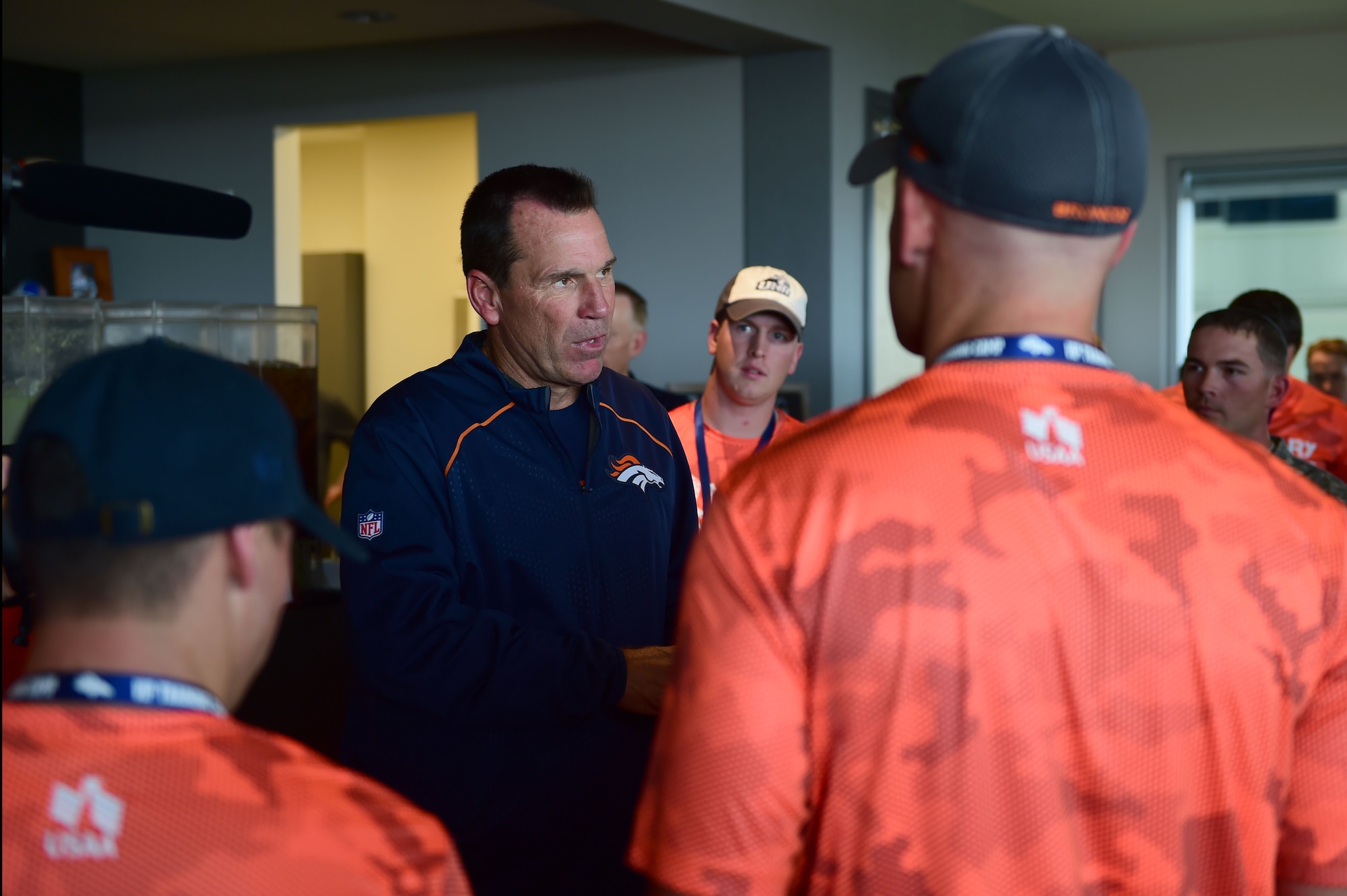 Greg Kubiak, Denver Broncos head coach, meets with military members after the Broncos morning practice to give his thanks and appreciation for their sacrifices Aug. 7, 2015, at Denver Broncos Headquarters Facility at Dove Valley in Denver. The combine consisted of drills similar to the ones prospective National Football League players are expected to complete during the NFL combine held in Indianapolis before the NFL draft. All participants were also treated to a viewing of the Broncos’ Friday morning practice and a visit from Broncos players, as well as the head coach. (U.S. Air Force photo by Airman 1st Class Luke W. Nowakowski/Released) 