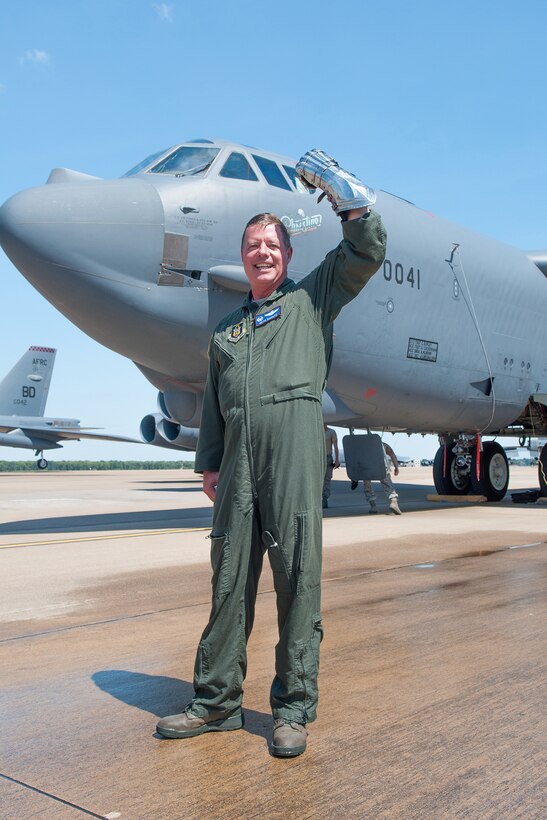 U.S. Air Force Col. Keith Schultz, commander of the 307th Operations Group, raises his armor clad fist in front of the last B-52H Stratofortress to be piloted by him. Schultz is a command pilot with over 7,000 flying hours of which 472 were flown in combat. (U.S. Air Force photo by Master Sgt. Dachelle Melville/Released) 