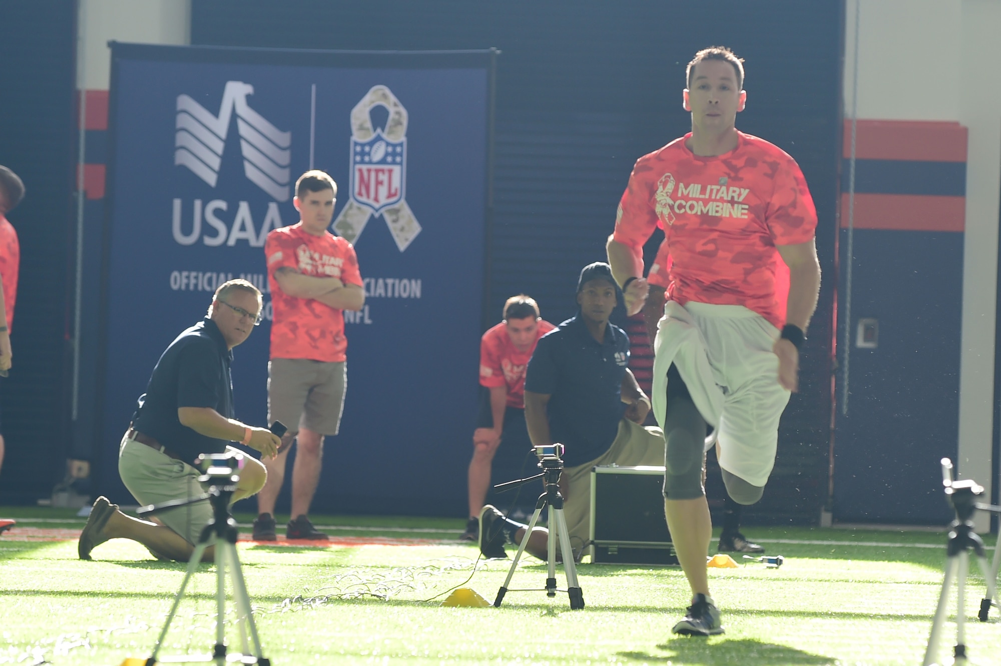 Tech. Sgt. Michael Boyd, 460th Comptroller Squadron finance superintendent, runs a timed 40- yard dash at the military combine Aug. 7, 2015, at the Denver Broncos Headquarters Facility at Dove Valley in Denver.  The combine consisted of drills similar to the ones prospective National Football League players are expected to complete during the NFL combine held in Indianapolis before the NFL draft. All participants were also treated to a viewing of the Broncos’ Friday morning practice and a visit from Broncos players, as well as the head coach. (U.S. Air Force photo by Airman 1st Class Luke W. Nowakowski/Released)