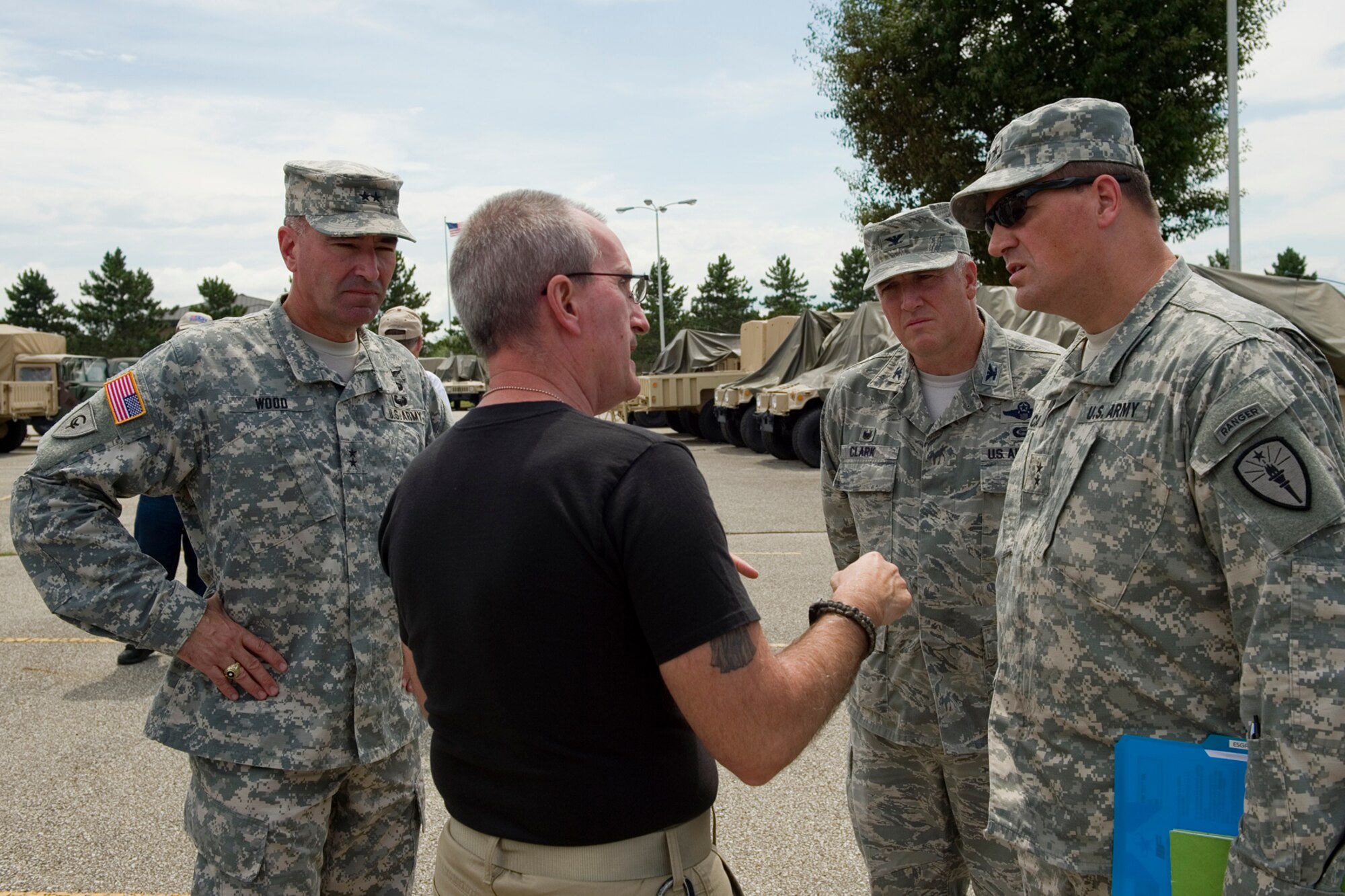 David Petroski, a contracted combat lifesaver course instructor, speaks with Maj. Gen. David Wood, 38th Infantry Division commander, left, Col. Kip Clark, 181st Intelligence Wing commander, center, and Maj. Gen. Courtney Carr, Indiana's Adjutant General, during a tour for civilian employers at Grissom Air Reserve Base, Ind., Aug. 6, 2015. The event was held to educate employers and to foster a stronger relationship between them the Guard and Reserve. (U.S. Air Force photo/Tech. Sgt. Benjamin Mota)