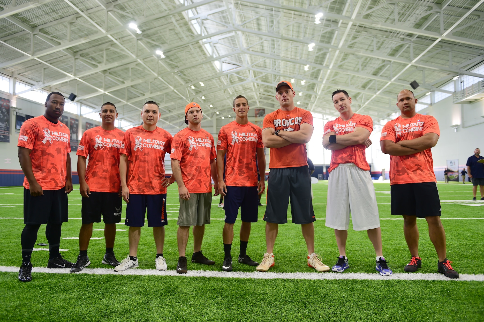Team Buckley members stand ready to take on the military combine hosted by the Denver Broncos organization and United Services Automotive Association Aug. 7, 2015, at the Denver Broncos Headquarters Facility at Dove Valley in Denver. The combine consisted of drills similar to the ones prospective National Football League players are expected to complete during the NFL combine held in Indianapolis before the NFL draft. All participants were also treated to a viewing of the Broncos’ Friday morning practice and a visit from Broncos players, as well as the head coach. (U.S. Air Force photo by Airman 1st Class Luke W. Nowakowski/Released)