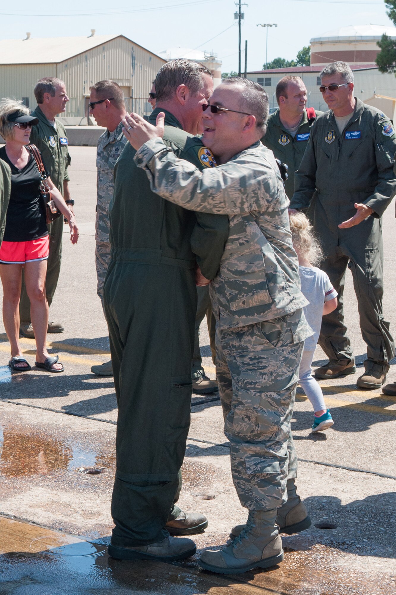 U.S. Air Force Col. Keith Schultz, commander of the 307th Operations Group, hugs Maj. Jerry Hardel, assigned to the 307th Operations Support Squadron, after his final flight of a B-52 Stratofortress on Barksdale Air Force Base, La. on Aug. 2, 2015. Schultz is a command pilot with over 7,000 flying hours. (U.S. Air Force photo by Master Sgt. Dachelle Melville/Released) 