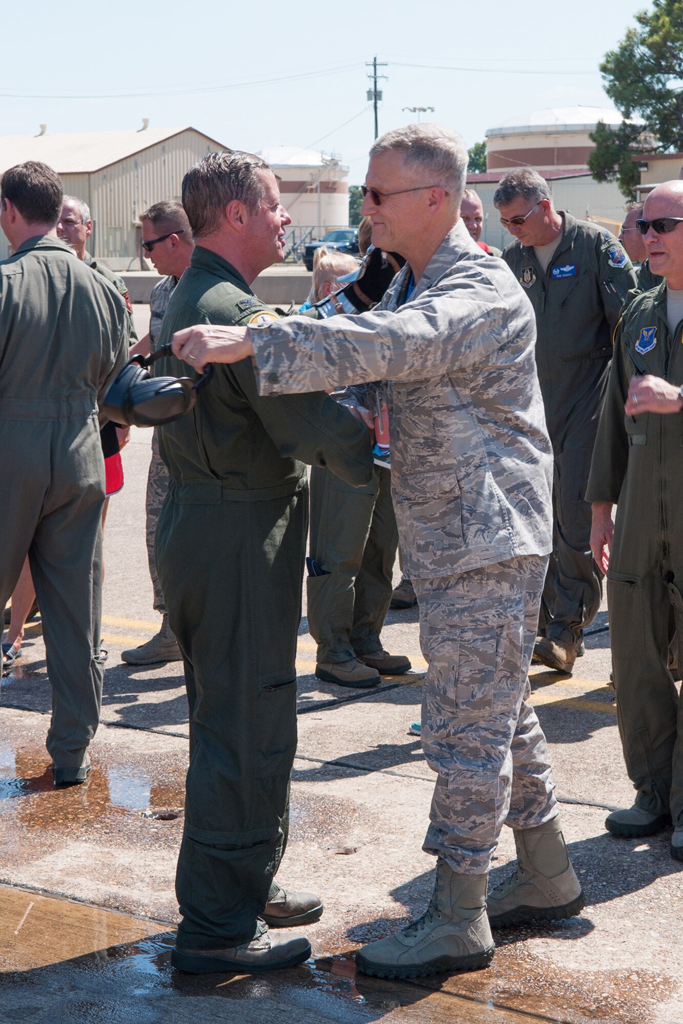 U.S. Air Force Col. Keith Schultz, commander of the 307th Operations Group, receives a farewell from the Deputy Commander of the 307th Maintenance Group, Col. Dwayne Slack, after his final flight on a B-52 Stratofortress on Barksdale Air Force Base, La. on Aug. 2, 2015. Schultz is a command pilot with over 7,000 flying hours. (U.S. Air Force photo by Master Sgt. Dachelle Melville/Released)