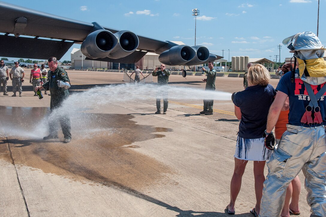 U.S. Air Force Col. Keith Schultz, commander of the 307th Operations Group, receives a shower after his final flight on a B-52H Stratofortress on Aug. 2, 2015 at Barksdale Air Force Base, La. Schultz is leaving Barksdale after 14 years and has over 7,000 flying hours in the bomber. (U.S. Air Force photo by Master Sgt. Dachelle Melville/Released)