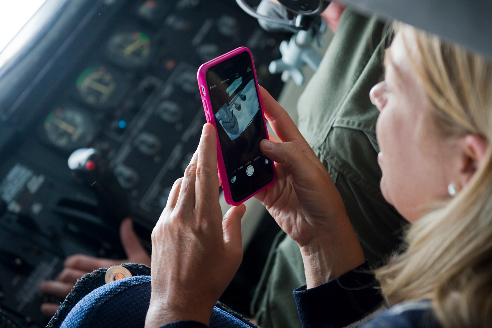 An employer gets a clear shot of a C-17 Globemaster being refueled by a KC-135R Stratotanker during an Indiana Employer Support of the Guard and Reserve event held here Aug. 7, 2015. Employers were nominated by Guard and Reserve members from the 434th Air Refueling Wing here, the 122nd Fighter Wing in Fort Wayne, Ind., the 181st Intelligence Wing in Terre Haute, Ind., and the Indiana ESGR to participate in a two-day tour and boss lift flight to educate and show appreciation of their support of the troops they employ. (U.S. Air Force photo/Senior Airman Jami K. Lancette)