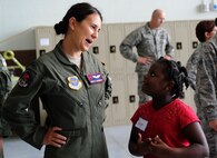 First Lt. Adria Trgovcich, 350th Air Refueling Squadron navigator, interacts with her mentee during the annual “Big for a Day” event, Aug. 6, 2015, at McConnell Air Force Base, Kan. The event was an opportunity for McConnell Airmen to spend time with and mentor children from the local community. (U.S. Air Force photo by Airman 1st Class Tara Fadenrecht) 