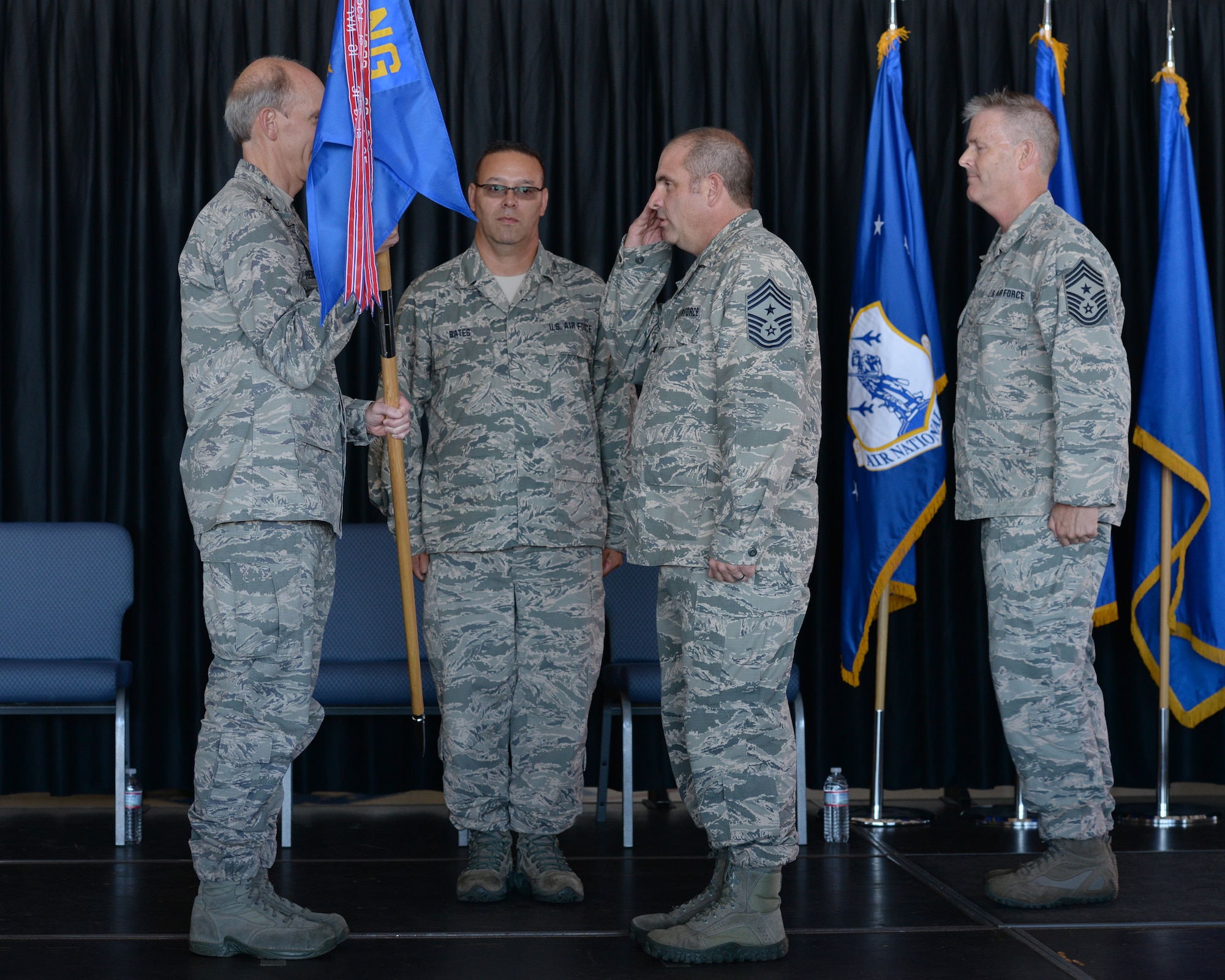 New Hampshire Air National Guard State Command Chief Master Sgt. David Obertanec salutes the N.H. National Guard Adjutant General Maj. Gen. William N. Reddel III during a change of authority ceremony at Pease Air National Guard Base, N.H., Aug. 9, 2015.  During the ceremony Chief Master Sgt. Matthew Collier relinquished authority to the Chief Master Sergeant David Obertanec. (U.S. Air National Guard photo by Staff Sgt. Curtis J. Lenz)
