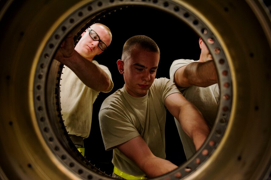 Maintainers from the 35th Maintenance Group, Misawa Air Base, Japan, work on a jet engine component during a graveyard shift on Spangdahlem Air Base, Germany, August 5, 2015. The shop divides Airmen into different sections with each working on a different part and function of the component’s work orders. The graveyard shift, also referred to as a swing shift, is a period of time when Airmen work from nighttime through early morning hours. (U.S. Air Force photo by Airman 1st Class Timothy Kim/Released)