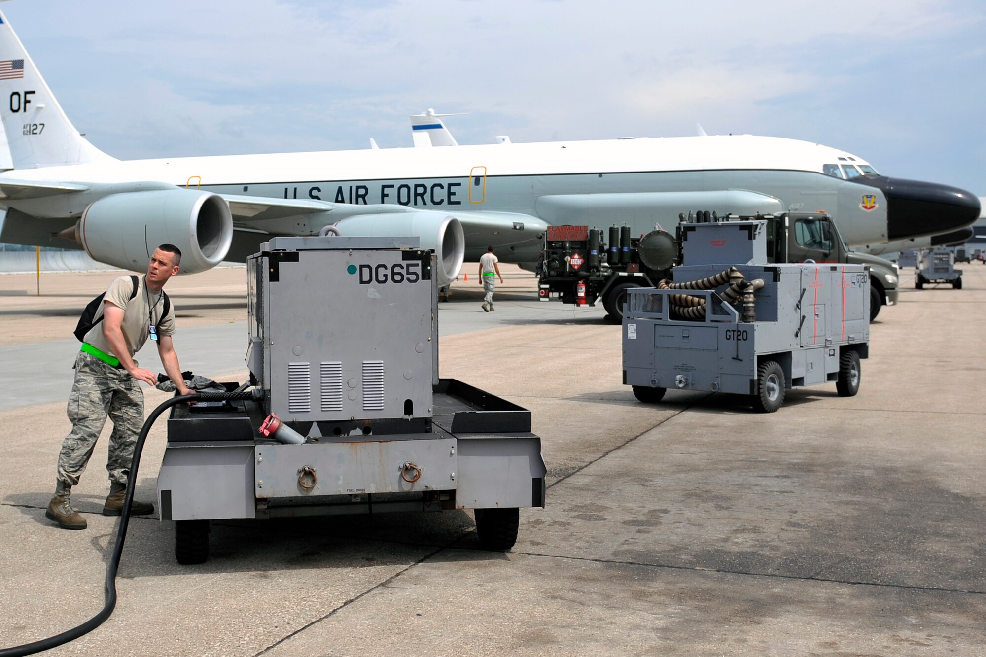 U.S. Air Force Airman 1st Class Nathan Dunster, 55th Intelligence Support Squadron electronic warfare systems apprentice, assembles the air cooling equipment for the RC-135 Rivet Joint Aug. 6 at Offutt Air Force Base, Nebraska. He recently scored a 94 percent on his eight-month RC-135 systems training, graduating top of his class. (U.S. Air Force photo by Jeff W. Gates/Released)
