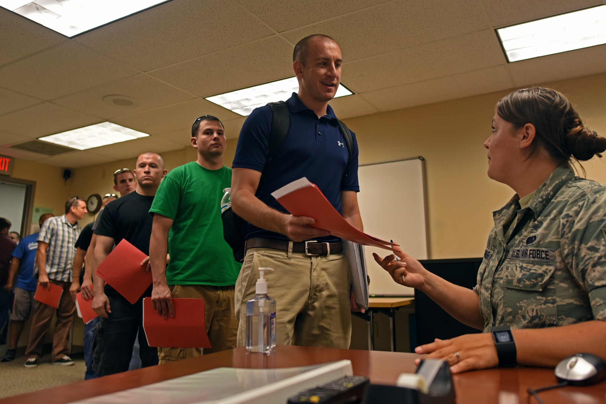 U.S. Air Force Senior Airman Bethany Trona-Farler, a recruiting assistant with the 121st Air Refueling Wing, speaks with members of the Individual Ready Reserve about opportunities in the Ohio Air National Guard during a Muster held July 31, 2015 at Rickenbacker Air National Guard Base, Ohio. IRR members are veterans that have time remaining on their statutory military service obligation of eight years and are required to participate in an annual screening until their remaining service time is completed. (U.S. Air National Guard photo by Airman Ashley Williams/Released)