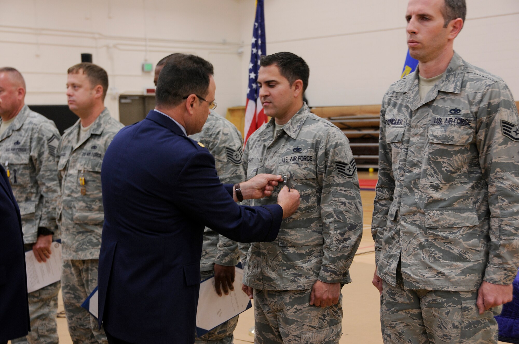 Airmen from the 482nd Maintenance Group receive Air Force Commendation Medal's for their outstanding achievements over the last six months during a commander's call in the Sam Johnson Fitness center at Homestead Air Reserve Base Fla., on Aug. 8 2015.  Several Airmen were recognized for their achievements, service to others and academic success during this event. (U.S. Air Force photo/Senior Aja Heiden)
