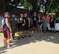 Staff Sgt. Phillip Simonsen holds up the trophy his team, The Sheep Dogs, had won during the 2nd Annual 185th Fitness Challenge on August 7, 2015 as members of the Wing Nuts, who won best costume, look on. Teams from different sections of the base had to complete physical challenges spread out over a mile and a half course during the event. (U.S. Air National Guard photo by Capt. Jeremy J. McClure/Released)