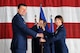 U.S. Air Force Col. Jill Scheckel takes the 55th Medical Group guidon from U.S. Air Force Col. Marty Reynolds, 55th Wing commander, during a change of command ceremony at the Bennie Davis Maintenance Facility on Offutt Air Force Base, Nebraska, Aug. 7. Scheckel took command of the mighty medics from U.S. Air Force Col. Stephen Mounts during the time honored ceremony. (U.S. Air Force photo by Jeff Gates)