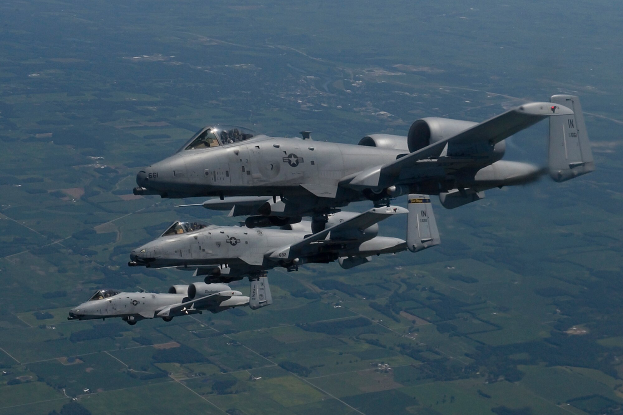 Three A-10 Warthog’s from the 122nd Fight Wing in Fort Wayne, Ind., form up next to a KC-135R Stratotanker during an Indiana Employer Support of the Guard and Reserve event held here Aug. 7, 2015. Employers saw two inflight refuelings and learned what their employees do in support of Air Force objectives.  (U.S. Air Force photo/Senior Airman Jami K. Lancette)