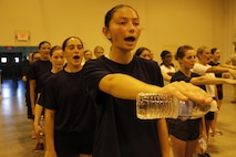 Female poolees cover and align during Marine Corps Recruiting Station Kansas City's all-hands female pool function at Camp Clark in Nevada, Mo., Aug. 7, 2015. The poolees learned close-order drill, techniques of the Marine Corps Martial Arts Program, and performed an Initial Strength Test.