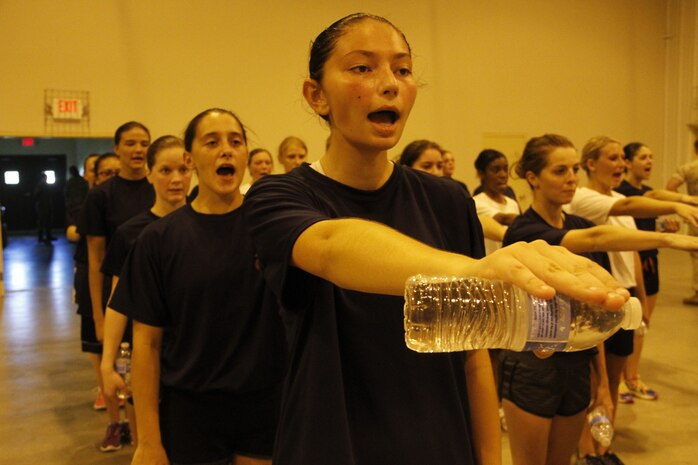 Female poolees cover and align during Marine Corps Recruiting Station Kansas City's all-hands female pool function at Camp Clark in Nevada, Mo., Aug. 7, 2015. The poolees learned close-order drill, techniques of the Marine Corps Martial Arts Program, and performed an Initial Strength Test.