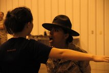 Sergeant Rosario Battiest, a Company N, 4th Recruit Training Battalion, Marine Corps Recruit Depot Parris Island drill instructor, instructs a poolee to speak more concisely during Marine Corps Recruiting Station Kansas City's all-hands female pool function at Camp Clark in Nevada, Mo., Aug. 7, 2015.