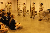 Sergeant Major Christopher A. Farrell, Marine Corps Recruiting Station Kansas City sergeant major, speaks to female poolees before turning the discussion over to a panel of female Marines of different ranks and MOSes during RS Kansas City's all-hands female pool function at Camp Clark in Nevada, Mo., Aug. 7, 2015.