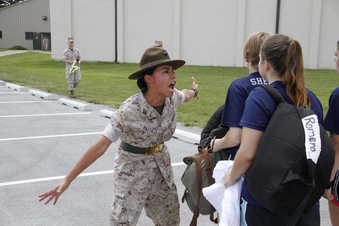Sergeant Rosario Battiest, a Company N, 4th Recruit Training Battalion, Marine Corps Recruit Depot Parris Island drill instructor, instructs a poolee to reach the proper volume in repsonse to a question during Marine Corps Recruiting Station Kansas City's all-hands female pool function at Camp Clark in Nevada, Mo., Aug. 7, 2015.