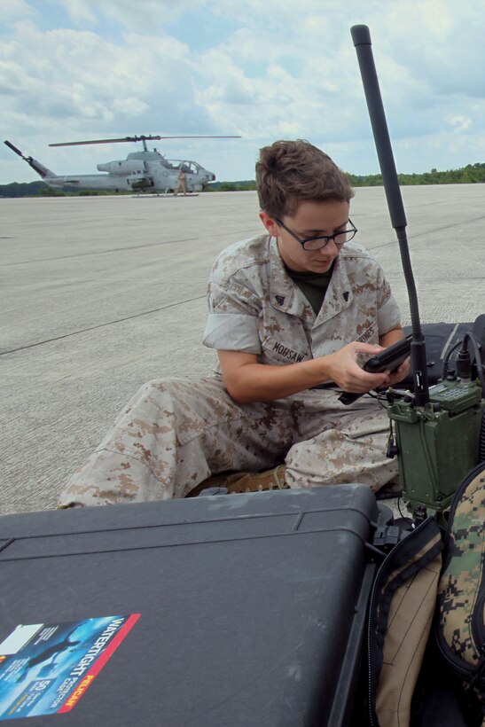 Cpl. Cassie Mousaw operates an AN/PRC-117 G wideband tactical radio and KILSWITCH tablets, during a training exercise testing a digital interoperability system at Marine Corps Air Station Cherry Point, North Carolina, July 24, 2015. Digital interoperability is the technology capable of increasing prowess on the battlefield.  The exercise included Marine Light Attack Helicopter Squadron 467, Marine Unmanned Aerial Vehicle Squadron 2, and U.S. Marine Corps Forces, Special Operations Command, testing a LINK 16 conversion system for one of the first times within an explicitly rotary-wing exercise.  Mousaw is a field radio operator with VMU-2.