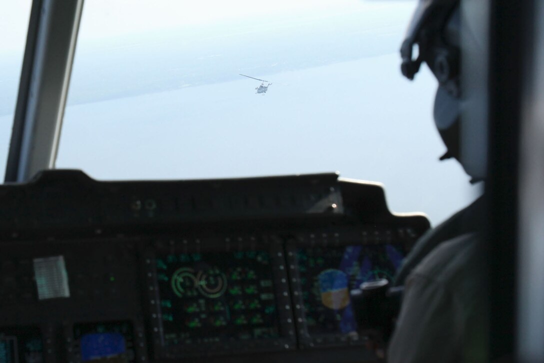 A UH-1Y Huey flies with an AH-1W Super Cobra during a training exercise testing a digital interoperability system at Marine Corps Air Station Cherry Point, North Carolina, July 24, 2015. Digital interoperability is the technology capable of increasing prowess on the battlefield. The exercise included Marine Light Attack Helicopter Squadron 467, Marine Unmanned Aerial Vehicle Squadron 2, and U.S. Marine Corps Forces, Special Operations Command, testing a LINK 16 conversion system for one of the first times within an explicitly rotary-wing exercise. 