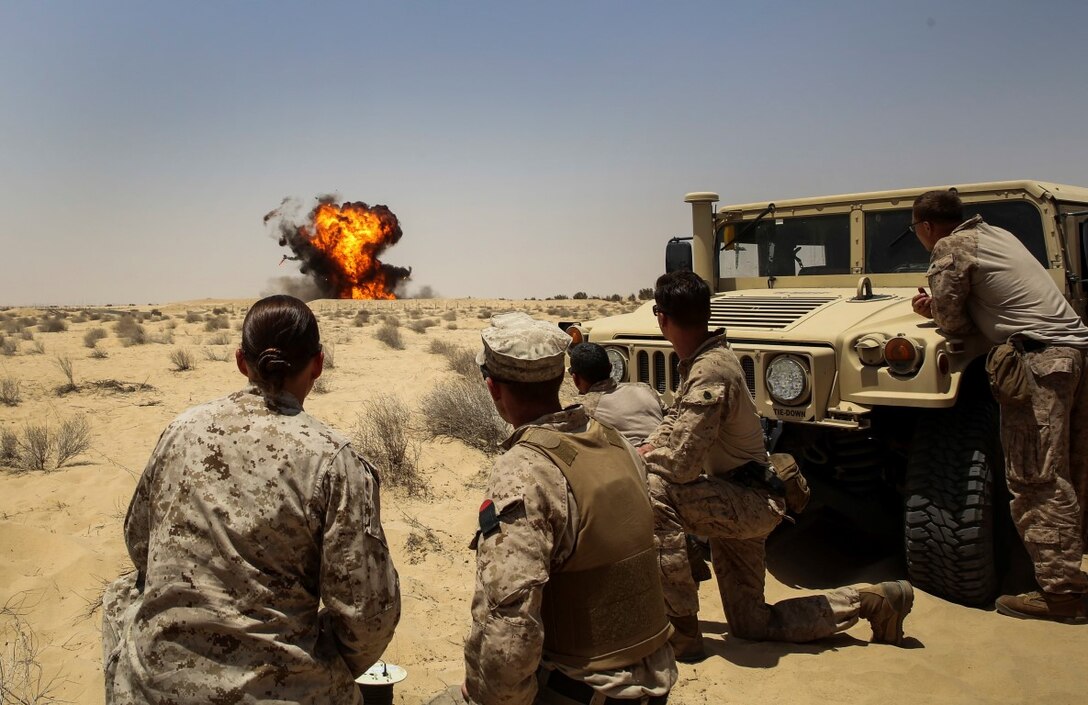 U.S. Marines with Special Purpose Marine Air-Ground Task Force—Crisis Response—Central Command, observe an explosion during a demolition range in Southwest Asia, July 17, 2015. The Marines and Sailors of SPMAGTF-CR-CC provide the commander of USCENTCOM with a flexible, task-organized set of solutions to emerging crises within an area of responsibility spanning 20 countries. (Courtesy Photo by U.S. Air Force Senior Airman Robin Markiewicz/RELEASED)