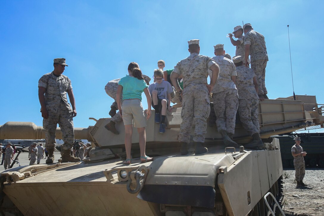 Marines with the 13th Marine Expeditionary Unit showcase a M1A1 Abrams tank to the Marines, Sailors and their families aboard Marine Corps Base Camp Pendleton, Calif., August 7, 2015. The 13th MEU held their Composite Ceremony, followed by a Family Day to signify unity of the newly composited Marine Air-Ground Task Force.