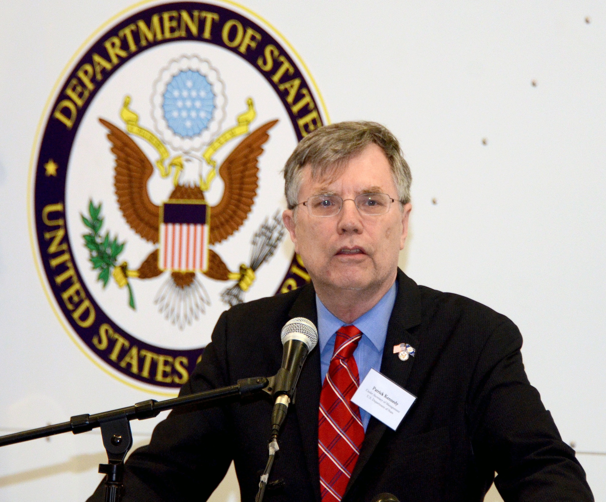 Patrick Kennedy, Under Secretary of Management, from the United States Department of State, addresses an audience of personnel from the Department of State, MRI Global, Paul Allen Foundation, and members of the 94th Airlift Wing, at an unveiling of the DOS Containerized Biocontainment System, held at Dobbins Air Reserve Base, Ga. Aug. 11, 2015. (U.S. Air Force photo/Don Peek)