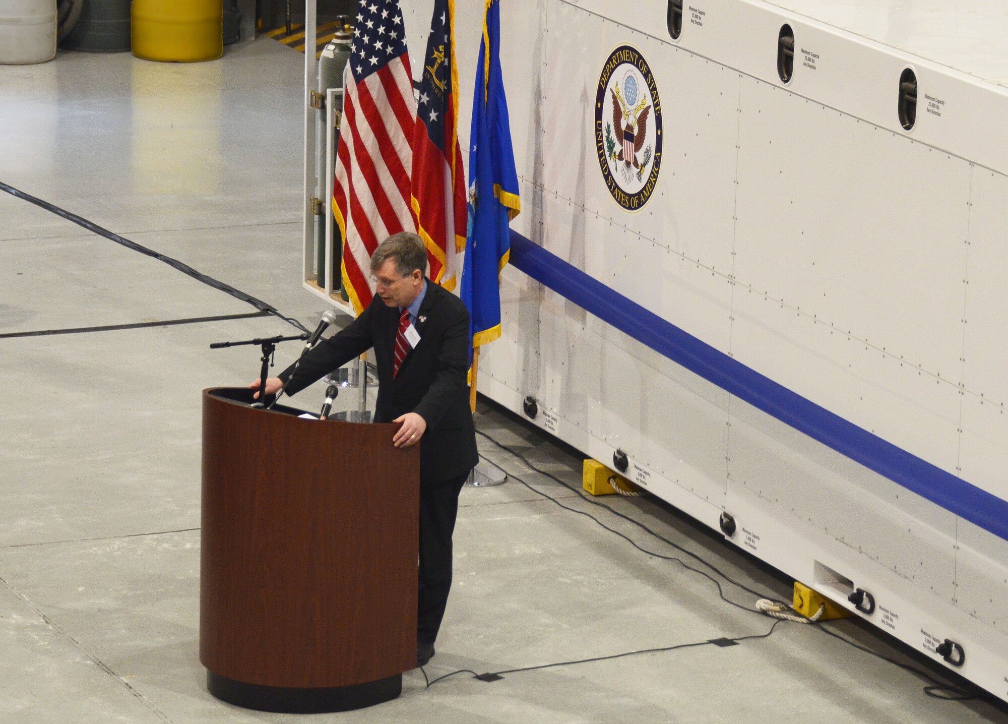 Patrick Kennedy, Under Secretary of Management, from the United States Department of State, addresses an audience of personnel from the Department of State, MRI Global, Paul Allen Foundation, and members of the 94th Airlift Wing, at an unveiling of the DOS Containerized Biocontainment System, held at Dobbins Air Reserve Base, Ga. Aug. 11, 2015. (U.S. Air Force photo/Don Peek)
