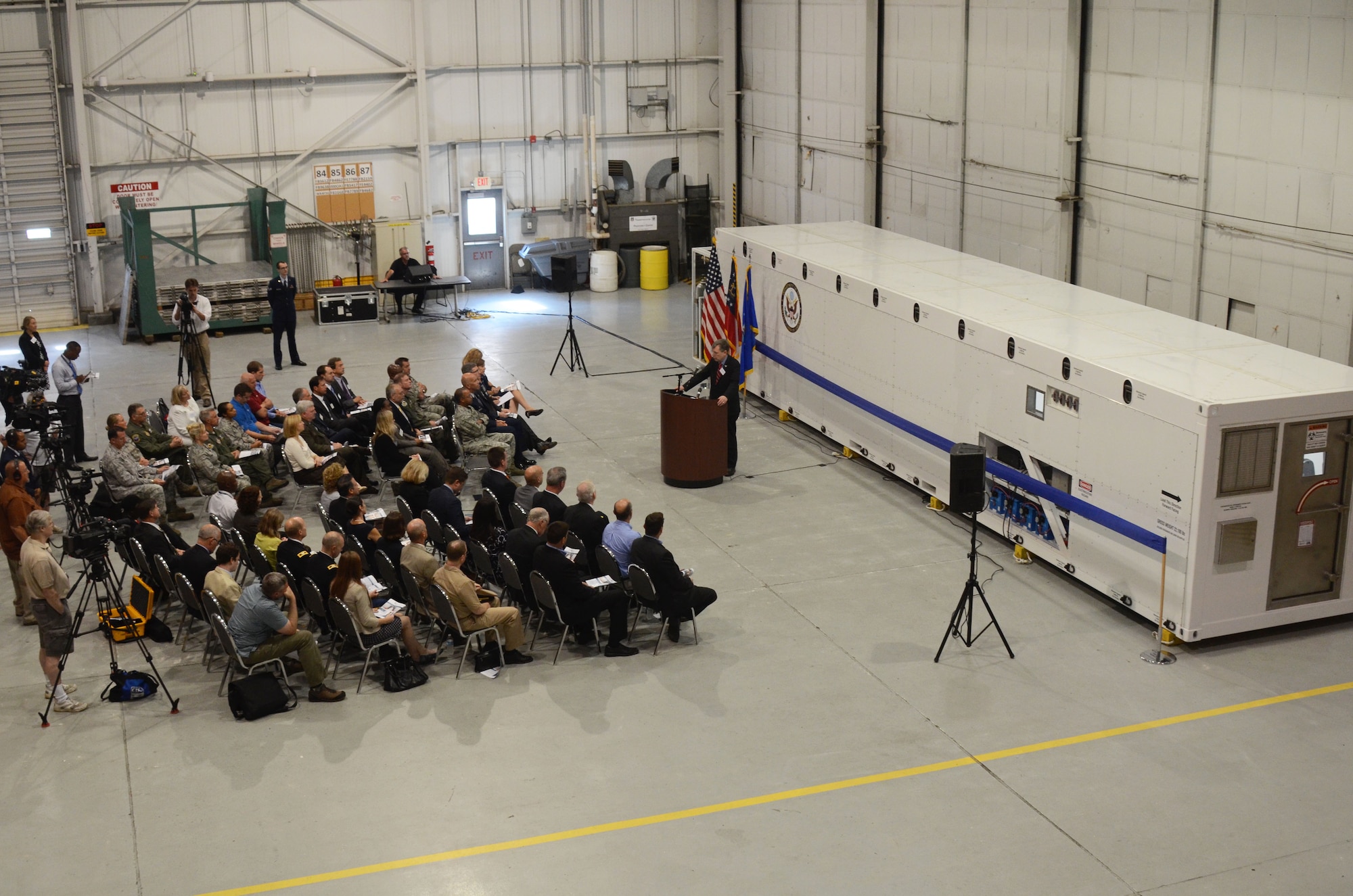 Patrick Kennedy, Under Secretary of Management, from the United States Department of State, addresses an audience of personnel from the Department of State, MRI Global, Paul Allen Foundation, and members of the 94th Airlift Wing, at an unveiling of the DOS Containerized Biocontainment System, held at Dobbins Air Reserve Base, Ga. Aug. 11, 2015. (U.S. Air Force photo/Don Peek)