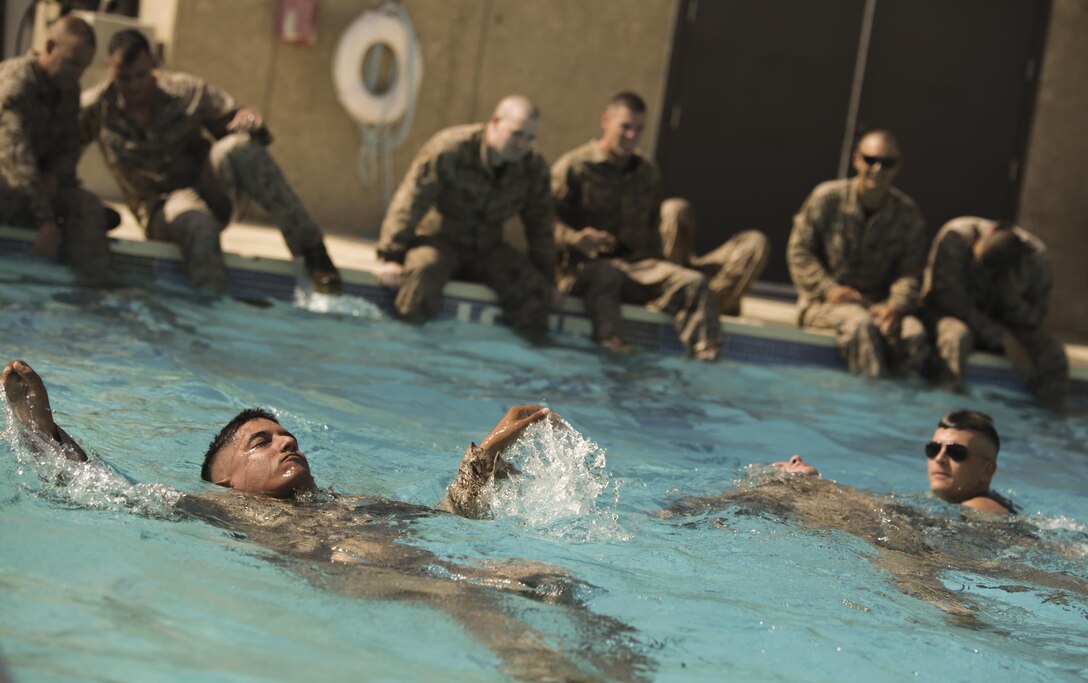 Lance Cpl. Adrien Garcia, motor transport mechanic with Company C., 4th Assault Amphibian Battalion, 4th Marine Division, Marine Forces Reserve, performs a 250-meter swim during his annual intermediate swim qualification at the Galveston Marine Corps Reserve Home Training Center, Aug. 8, 2015. All Marines with Company C. are required to complete and maintain an annual intermediate swim qualification.  (U.S Marine Corps photo by Corporal Ian Ferro)