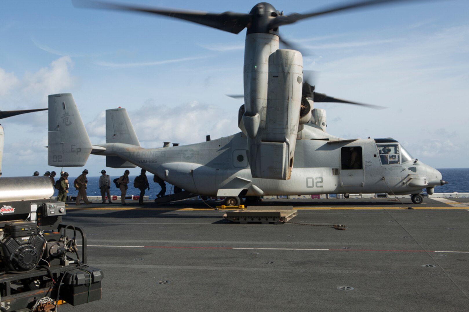 BONHOMME At Sea (Aug. 8, 2015) - U.S. Marines and sailors with the 31st Marine Expeditionary Unit load into an MV-22B Osprey aboard the USS Bonhomme Richard (LHD 6). The 31st MEU is staging Ospreys in Guam in support of typhoon recovery efforts in Saipan. The aircraft will be on standby in the event their aerial lift capacity is needed to distribute emergency supplies to remote areas. Saipan, the most populated island in the Commonwealth of the Northern Mariana Islands, was struck by Typhoon Soudelor Aug. 2-3. 