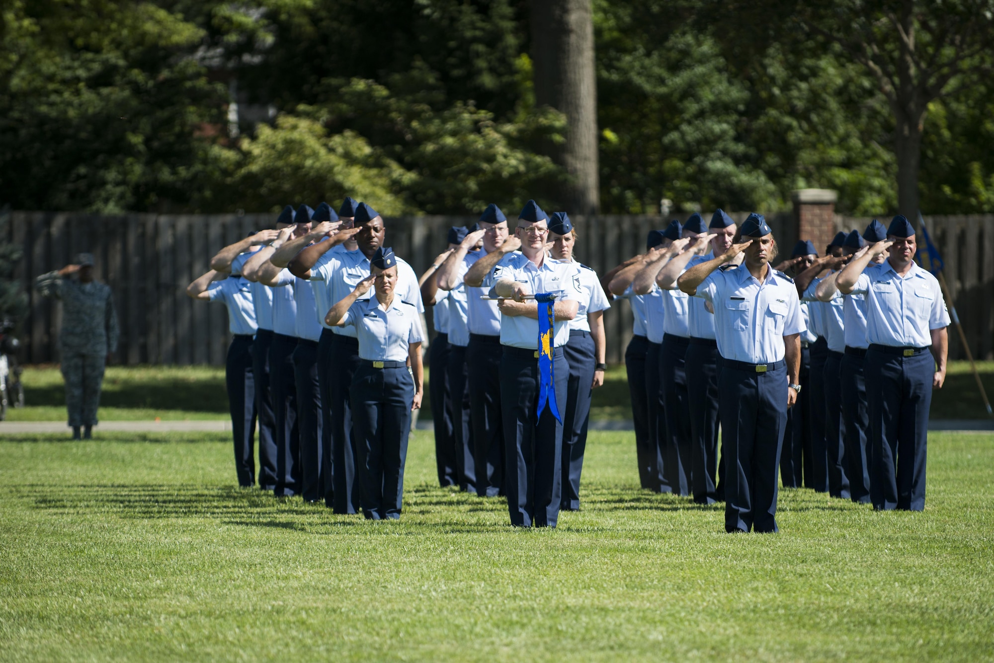Airmen assigned to Headquarters Air Mobility Command, located at Scott Air Force Base, Ill., stand in formation during the AMC change of command ceremony Aug. 11, 2015. Gen. Carlton D. Everhart II assumed command of AMC from Gen. Darren W. McDew, who will be the new commander of U.S. Transportation Command. (U.S. Air Force photo/Staff Sgt. Clayton Lenhardt)