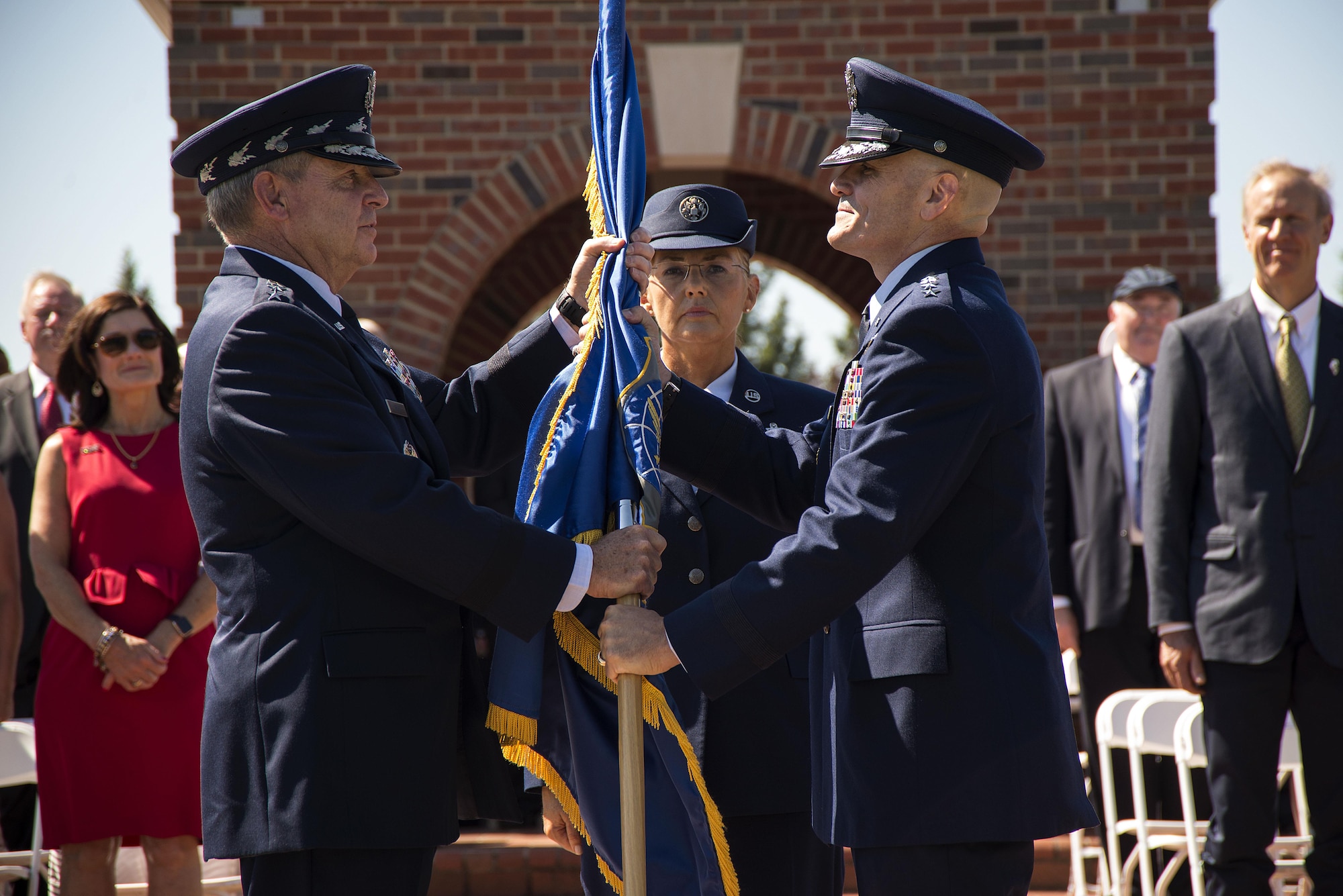 Chief of Staff of the Air Force Gen. Mark A. Welsh III passes the Air Mobility Command guidon to Gen. Carlton D. Everhart II during the AMC change of command ceremony at Scott Air Force Base, Ill., Aug. 11, 2015. Everhart is the 12th commander of AMC since its activation June 1, 1992. (U.S. Air Force photo/Senior Airman Jake Eckhardt)