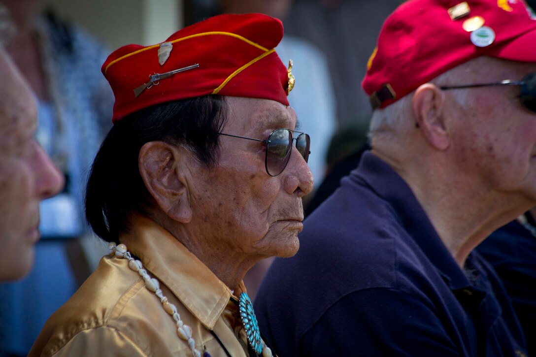 ASAN, Guam (March 19, 2015) -- Former Private First Class Samuel Holiday, a Navajo code talker, sits with fellow veterans of World War II and other U.S. conflicts during a luncheon at Rear Adm. Bette Bolivar's home. The commander for Joint Region Marianas hosted the veterans at her home on Nimitz Hill for lunch, refreshments and a slice of cake during their island tour visiting war memorials and battle sites. The veterans group then traveled to Iwo Jima, now known officially as Ioto, commemorating the 70th anniversary of the Battle of Iwo Jima.  (U.S. Marine Corps photo by Lance Cpl. Jacob Snouffer/Released)