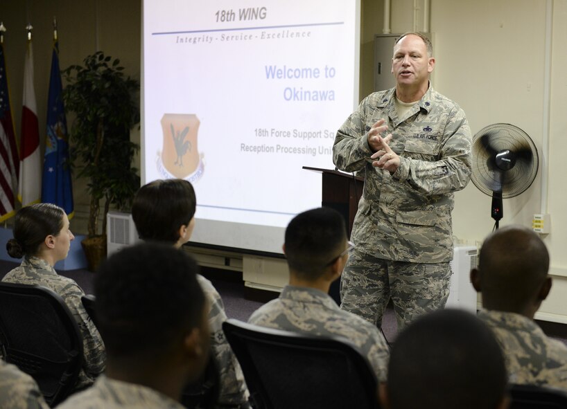 U.S. Air Force Lt. Col. Kieran Keelty, 18th Mission Support Group deputy commander, briefs approximately 50 Airmen at the reception processing unit during a Mission Focused Exercise on Kadena Air Base, Japan, Aug. 5, 2015. The exercise, known as Beverly High 15-3, is the third MFE conducted at Kadena Air Base for Fiscal Year 2015. It is designed to simulate contingency operations taken from one or more of the wing's mission sets such as forward power projection with the purpose of polishing procedures and demonstrating capabilities. (U.S. Air Force photo by Airman 1st Class John Linzmeier)