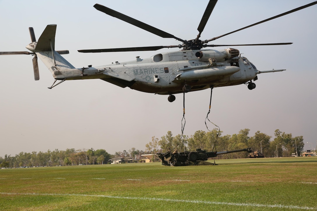 A U.S. Marine Corps CH-53E Super Stallion helicopter with Marine Heavy Helicopter Squadron 463, Marine Rotational Force – Darwin, releases the straps after an external lift of an M777A2 lightweight 155 mm howitzer  Aug. 5, at Robertson Barracks, Palmerston, Northern Territory. The Marine pilots and aircrew, along with soldiers with 8th/ 12th Regiment, Royal Australian Artillery, 1st Brigade, Australian Army, Australian Defence Force, planned and conducted the external lift of the howitzer and familiarized both units with each other’s training procedures to enhance interoperability. The MRF-D six-month deployment demonstrates how the Marine Air-Ground Task Force is equipped and organized to carry out national objectives in cooperation with our international partners. 