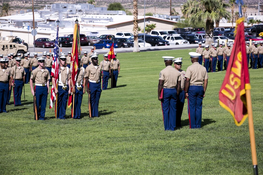 Marines with 1st Tank Battalion stand in formation while 1st Sgt. Nelson A. Hidalgo, Company A First Sergeant, 1st Tanks, receives the Meritorious Service Medal during his retirement ceremony at Lance Cpl. Torrey L. Gray Field, Aug. 7, 2015. Over the course of his career Hidalgo was meritoriously promoted four times. (Official Marine Corps photo by Pfc. Levi Schultz/Released)