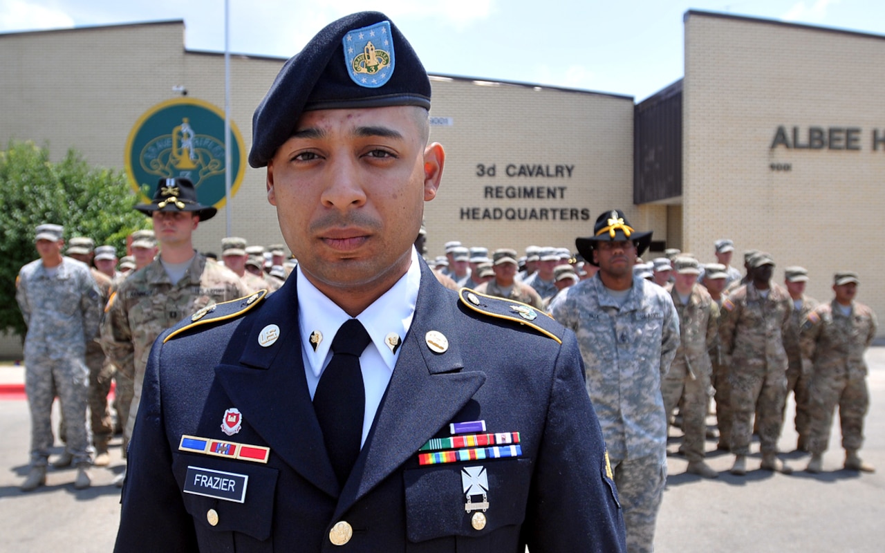 Army Spc. Gilbert Frazier, a combat engineer assigned to Pioneer Squadron, 3rd Cavalry Regiment, stands outside the regimental headquarters after he was pinned with a Purple Heart medal by Army Maj. Gen. Michael Bills, commander of the 1st Cavalry Division, at a ceremony on Fort Hood, Texas, July 31, 2015. Frazier suffered serious injuries from a roadside bomb blast while on a route clearing mission during the regiment’s last deployment to Afghanistan. U.S. Army photo by Spc. Erik Warren