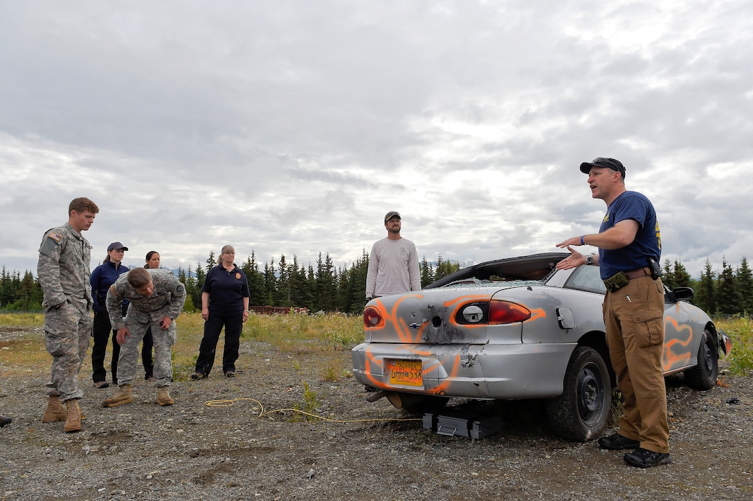 FBI special agent bomb technician James Elliott instructs airmen and soldiers during explosive training on Joint Base Elmendorf-Richardson, Alaska, July 29, 2015. 